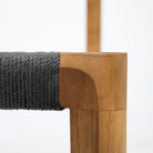 Teak dining chair with black loom seat view 